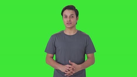 Happy-Indian-man-talking-to-someone-Green-screen