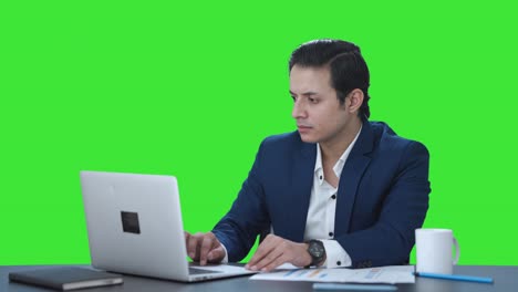 Indian-corporate-employee-working-on-laptop-Green-screen