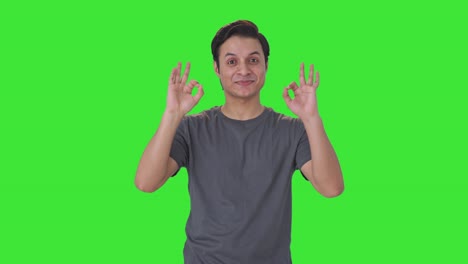Happy-Indian-man-showing-okay-sign-Green-screen