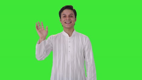 Happy-Indian-man-waving-hello-to-the-camera-Green-screen