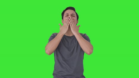 Happy-Indian-man-giving-flying-kisses-Green-screen