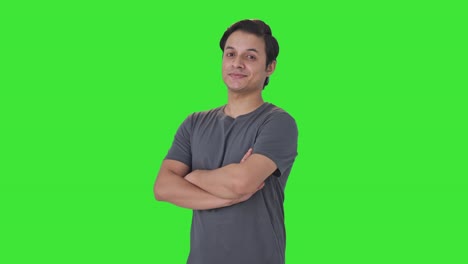 Portrait-of-Happy-Indian-man-standing-crossed-hands-Green-screen
