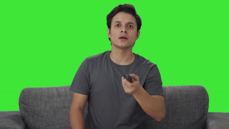 Indian-man-sees-a-shocking-news-on-TV-Green-screen