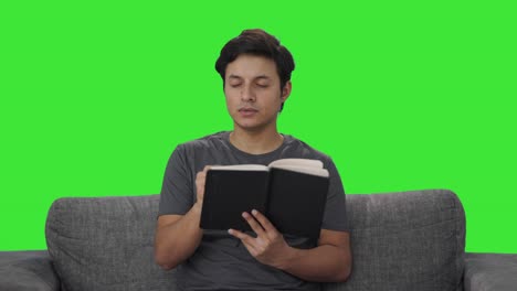 Indian-man-writing-in-diary-Green-screen