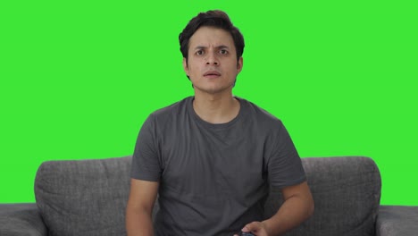 Frustrated-Indian-man-watching-TV-Green-screen
