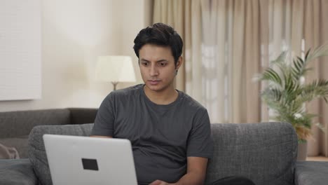 Indian-man-working-on-laptop