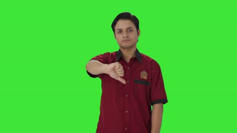 Disappointed-Indian-house-keeper-showing-thumbs-down-Green-screen