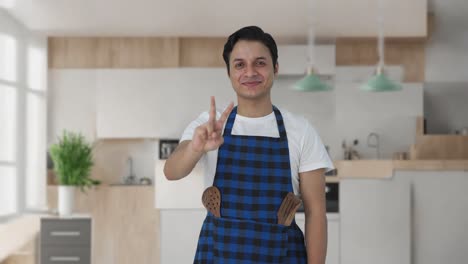 Happy-Indian-cook-showing-victory-sign