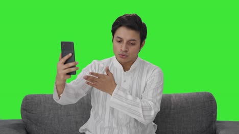 Indian-man-talking-on-video-call-Green-screen