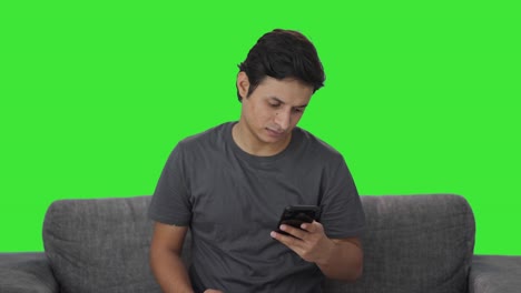 Happy-Indian-man-using-phone-Green-screen