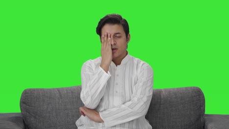 Upset-Indian-man-slapping-his-head-Green-screen