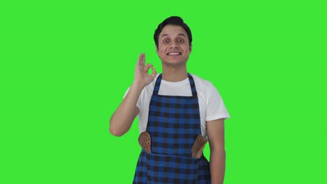 Happy-Indian-cook-showing-okay-sign-Green-screen