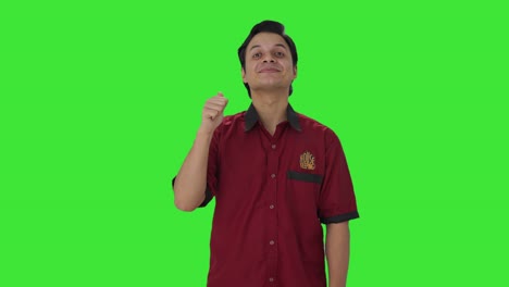 Happy-Indian-house-keeper-showing-thumbs-up-Green-screen