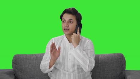 Indian-man-talking-on-phone-Green-screen