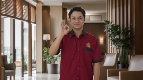Happy-Indian-house-keeper-showing-okay-sign