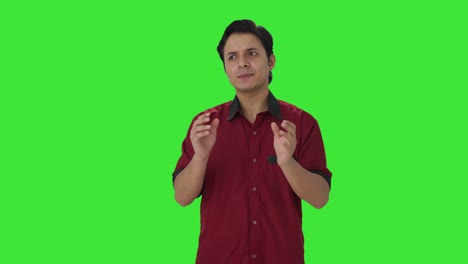 Happy-Indian-house-keeper-talking-to-someone-Green-screen