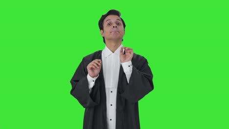 Happy-Indian-lawyer-talking-to-someone-Green-screen