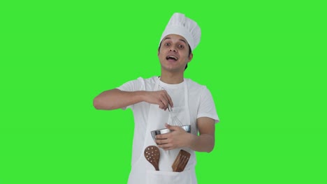 Happy-Indian-professional-chef-telling-recipe-Green-screen