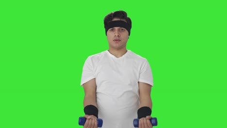 Serious-Indian-man-lifting-dumbbells-Green-screen