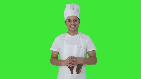 Happy-Indian-professional-chef-smiling-to-the-camera-Green-screen