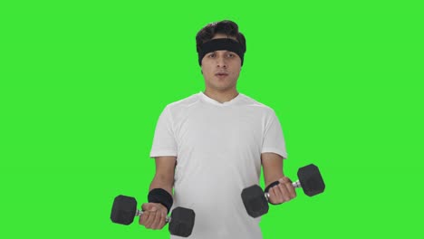 Serious-Indian-man-lifting-heavy-dumbbells-Green-screen
