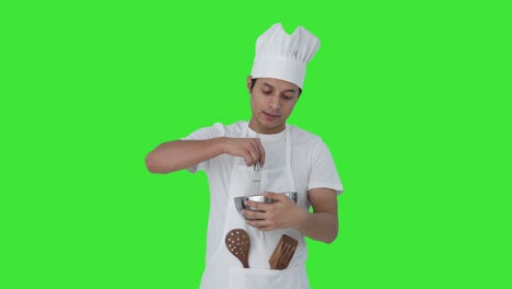Indian-professional-chef-telling-recipe-Green-screen