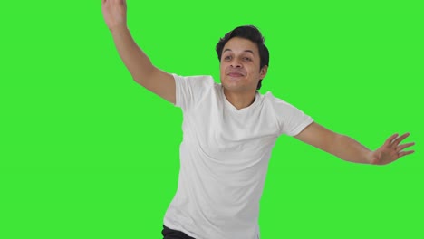 Happy-Indian-man-dancing-and-enjoying-Green-screen