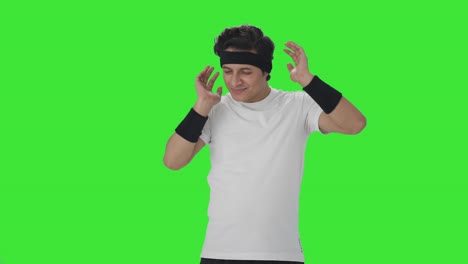 Happy-Indian-man-doing-neck-exercise-Green-screen