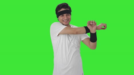 Happy-Indian-man-doing-arm-exercise-Green-screen