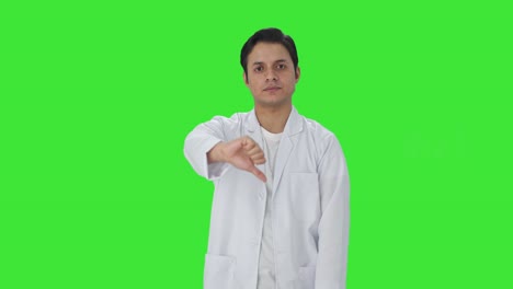 Disappointed-Indian-scientist-showing-thumbs-down-Green-screen