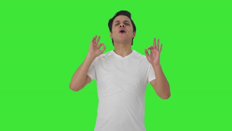 Happy-Indian-man-showing-okay-sign-Green-screen