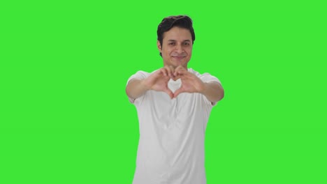 Happy-Indian-man-showing-heart-sign-Green-screen
