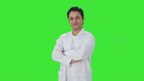 Portrait-of-Happy-Indian-scientist-standing-crossed-hands-Green-screen