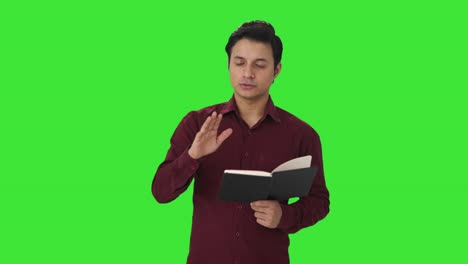 Happy-Indian-teacher-solving-student-problems-Green-screen