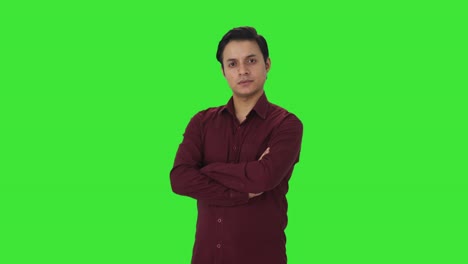 Portrait-of-confident-Indian-teacher-standing-crossed-hands-Green-screen
