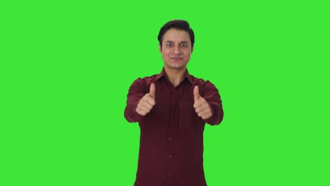 Happy-Indian-teacher-showing-thumbs-up-Green-screen