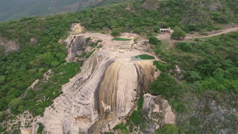 Aerial-tilt-down-shot-of-Hierve-el-Agua-ponds-in-Mexico
