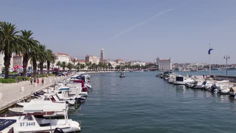 Low-aerial-over-Matejuška-marina-toward-popular-Split-Riva-promenade,-Croatia