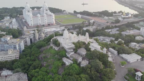 Aerial-footage-of-the-Birla-Mandir,-which-is-at-the-centre-of-Hyderabad,-footage-of-Hussain-Sagar-Lake,-Telangana-State-New-Secretariat