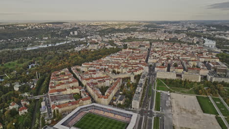 Prague-Czechia-Aerial-v105-flyover-Stary-Bubenec-capturing-epet-arena,-Letna-hilltop-park-and-cityscape-of-Holesovice-and-neighborhood-across-vltava-river---Shot-with-Mavic-3-Cine---November-2022