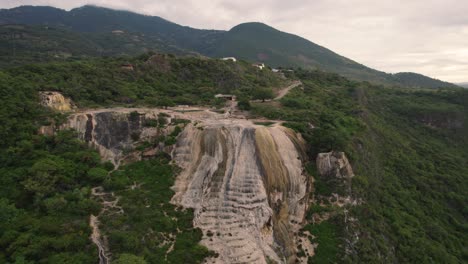 Hierve-el-Aqua-aerial-drone-view-of-natural-pools,-rock-formations-and-waterfalls