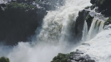Large-Splashing-Water,-View-of-Huge-Crashing-Waterfall-into-Large-Plunge-Pool-Below,-Hard-Eroding-Rocky-Landscape-from-Aggressive-Falling-Water-Streams-in-Iguacu-Falls,-Argentina,-South-America
