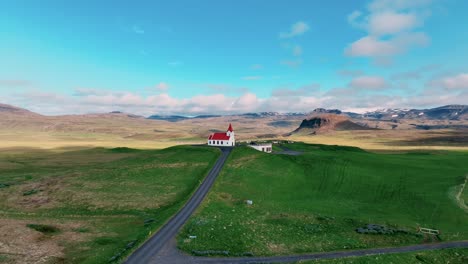 Road-Leading-To-Historic-Ingjaldsholl-Church-In-Hellisandur,-Snaefellsnes-Peninsula,-West-Iceland
