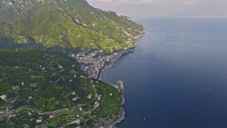 Maiori-Italy-Aerial-v1-cinematic-drone-flyover-Minori's-coastal-hillside-capturing-picturesque-town-center-nestled-between-the-mountains-and-azure-Tyrrhenian-sea---Shot-with-Mavic-3-Cine---May-2023