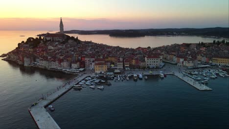 Aerial-panorama-of-sunset-in-the-old-town-of-Rovinj,-Famous-ancient-Croatian-city-on-the-sea,-Istria,-Croatia