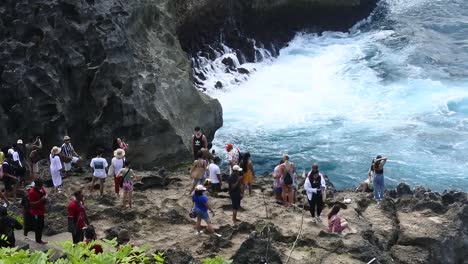 Slow-motion-shot-of-Tourists-see-the-powerful-crashing-of-sea-waves