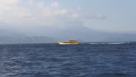 Tourism-Boats-sailing-drove-home-from-Nusa-Penida-Island,-Bali,-Indonesia