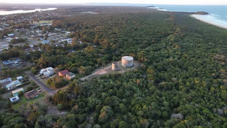 Aerial-View-Of-Industrial-Round-Storage-Tanks---Iluka-Nature-Reserve-In-Iluka,-NSW,-Australia