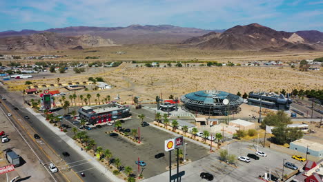 Drone-shot-toward-the-construction-site-of-the-UFO-Hotel,-in-sunny-Baker,-CA,-USA