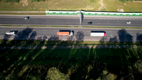 Aerial-top-view-showing-traffic-on-highway-in-Poland-at-sunny-day